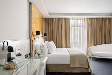 a room with a bed and a desk