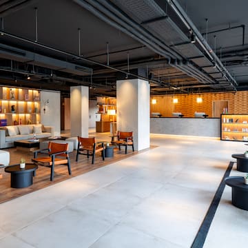 a room with a large reception desk and a couch