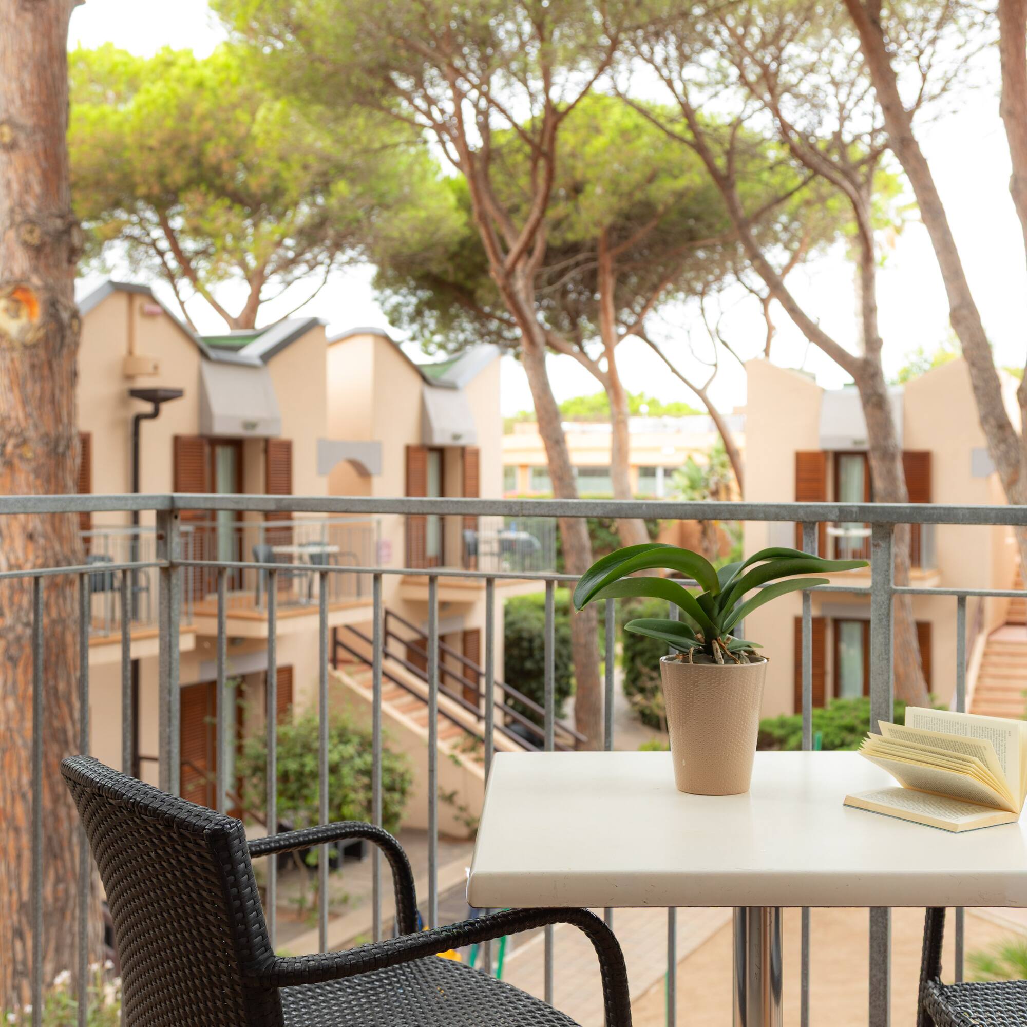a table with a book and a plant on it