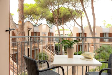 a table with a book and a plant on it