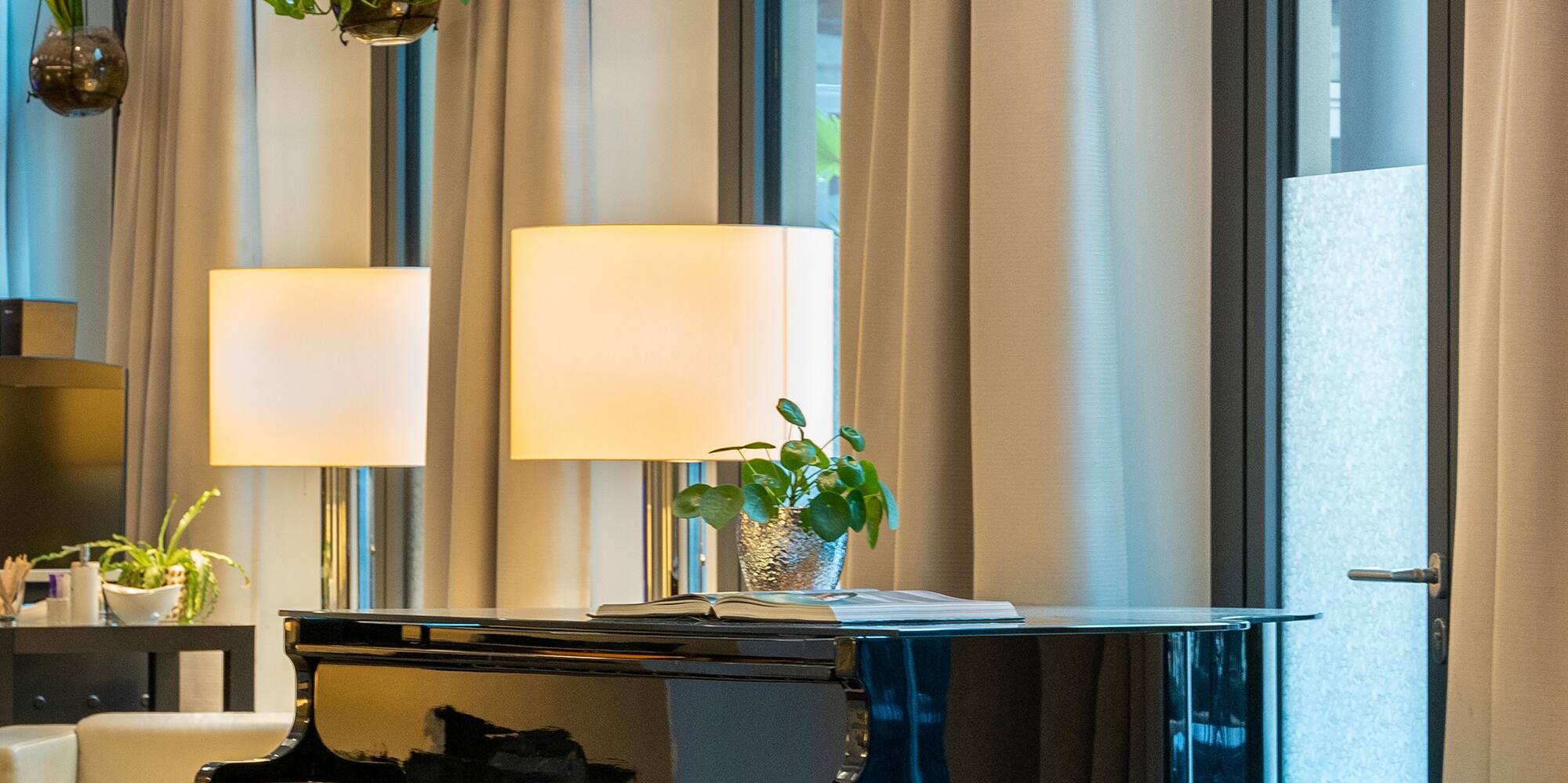 a room with a piano and chairs