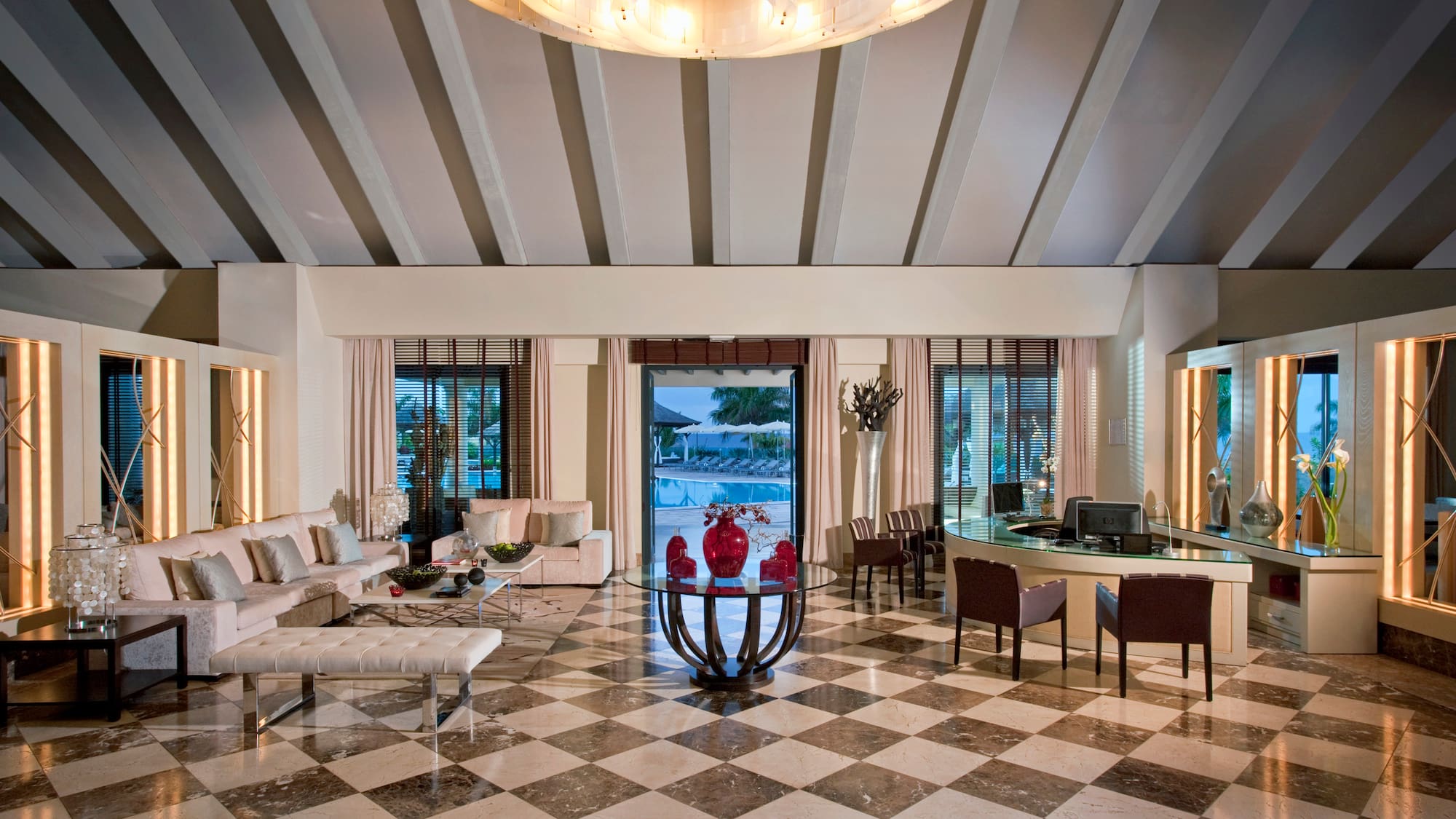 a room with a checkered floor and a table and chairs