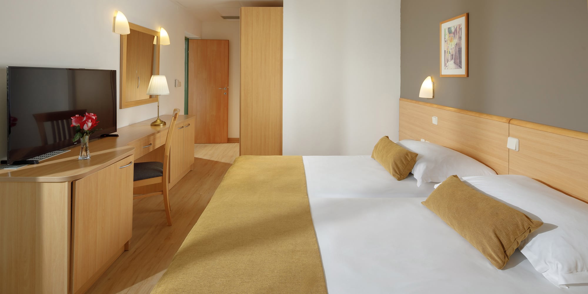 a room with a bed and a desk