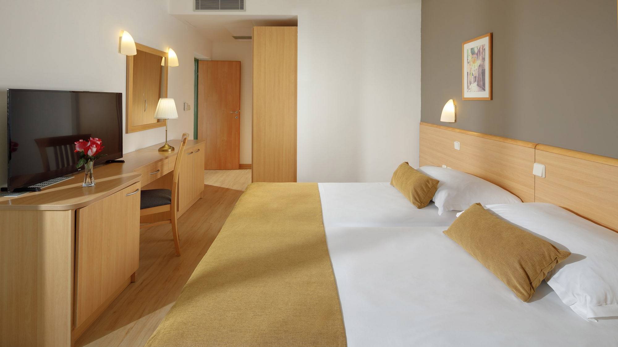 a room with a bed and a desk