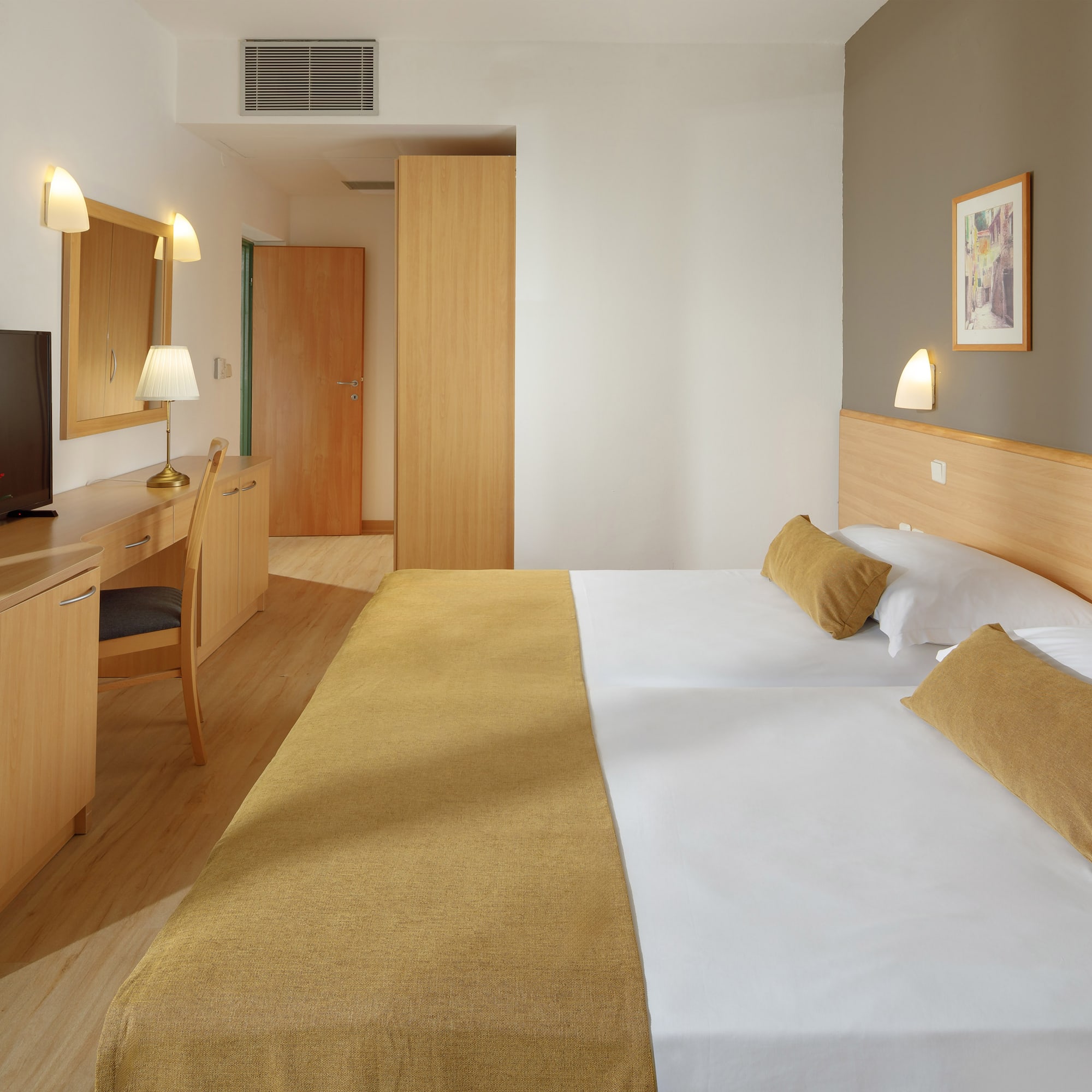 a room with a bed and a desk