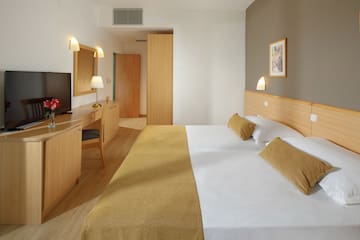 a room with a bed and a desk