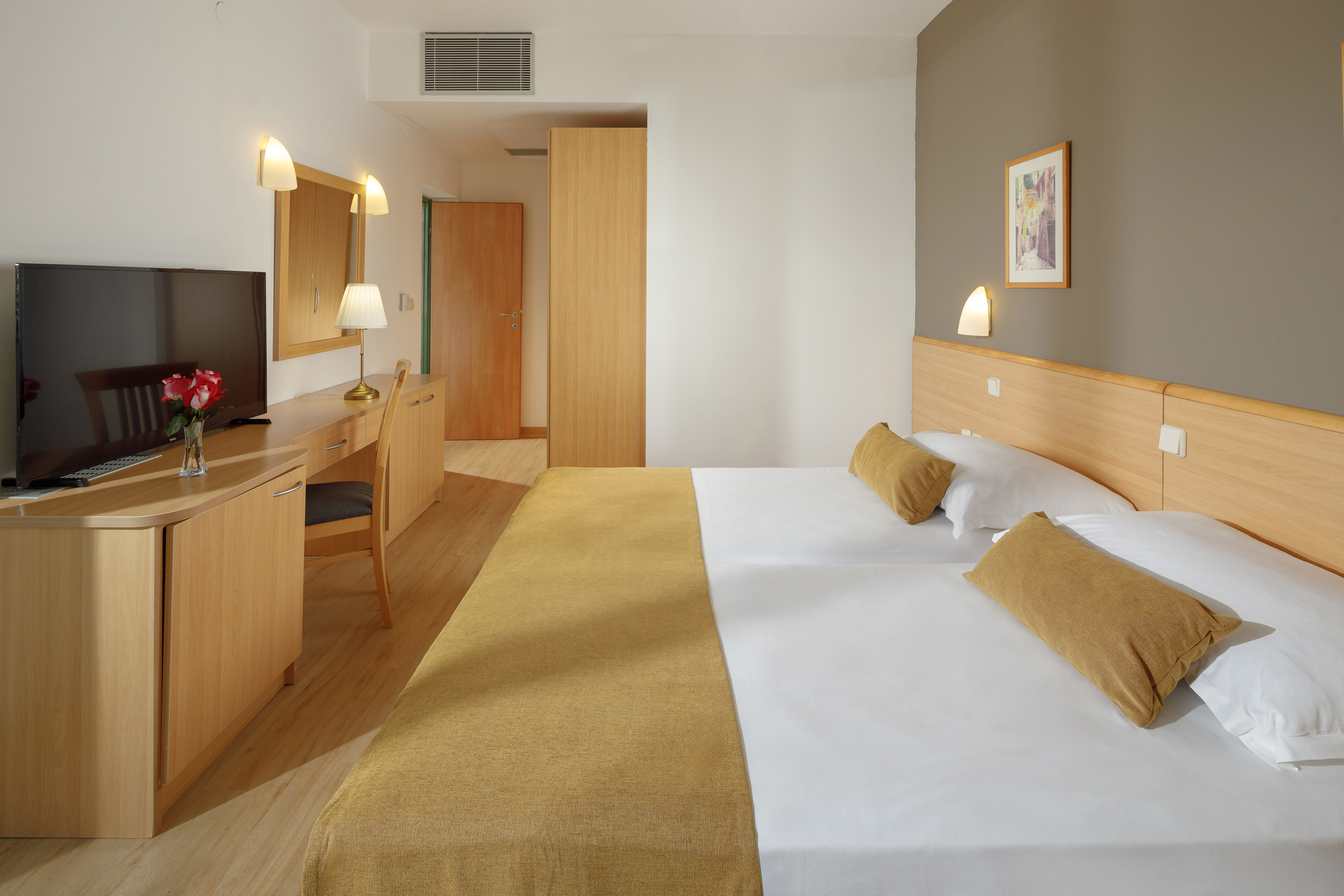 a room with a bed and a desk