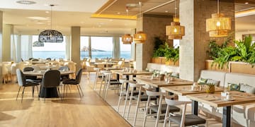 a restaurant with tables and chairs