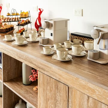 a table with cups and saucers on it