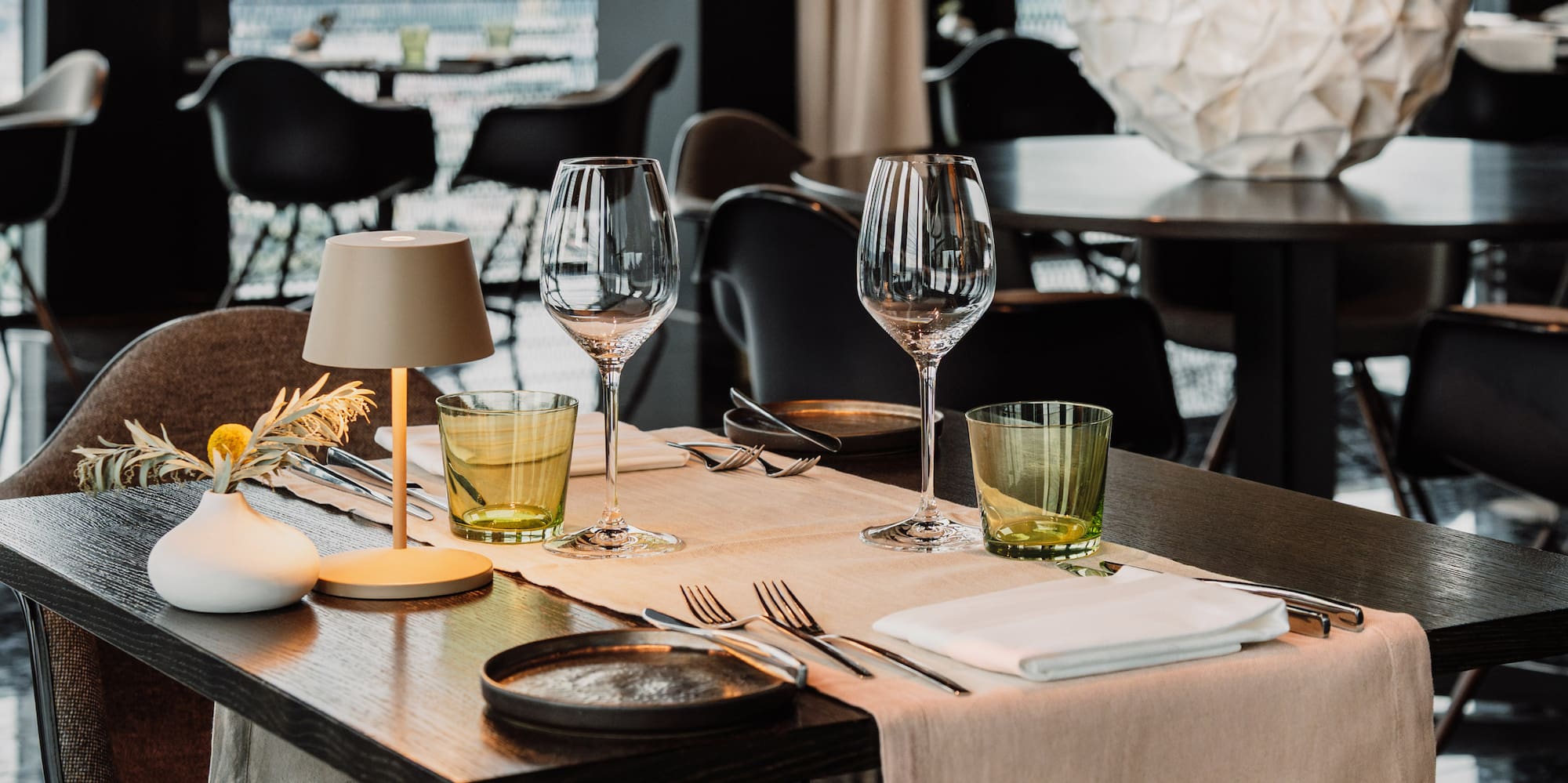 a table with glasses and napkins on it