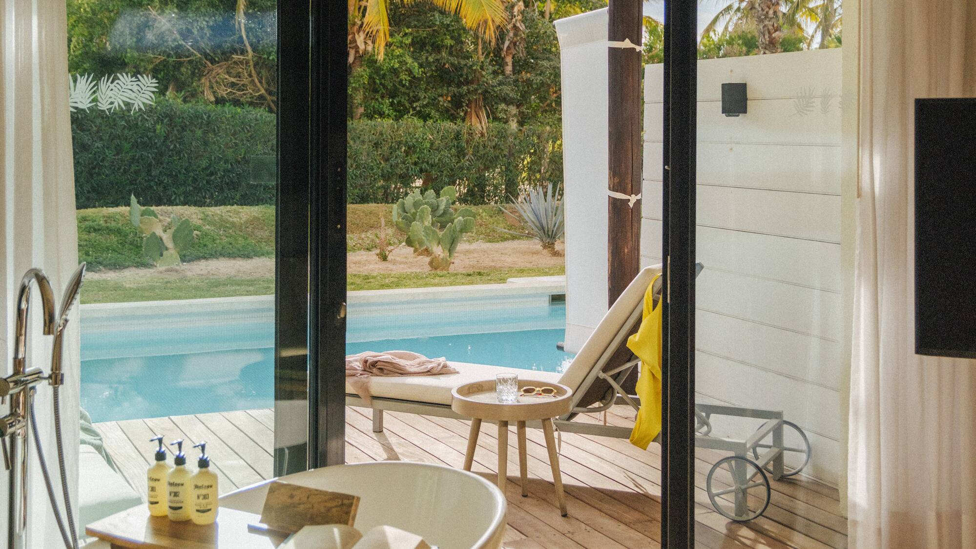 a bathroom with a tub and a pool