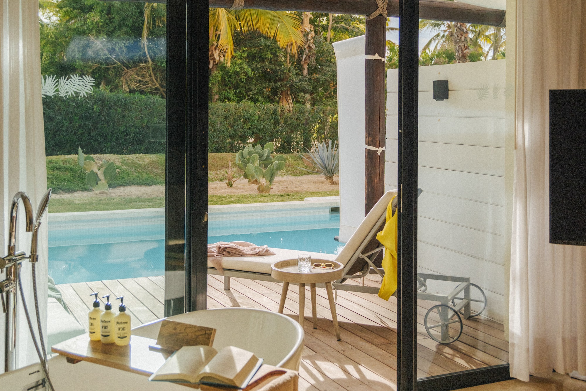 a bathroom with a tub and a pool
