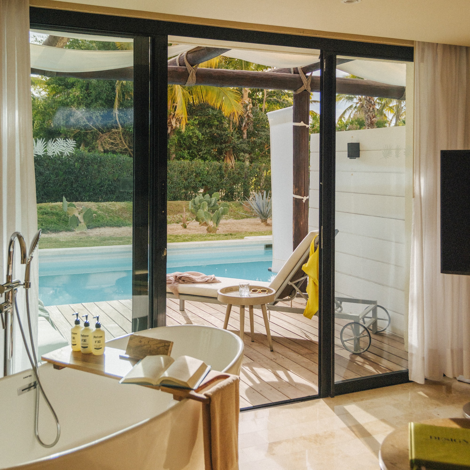 a bathroom with a tub and a pool