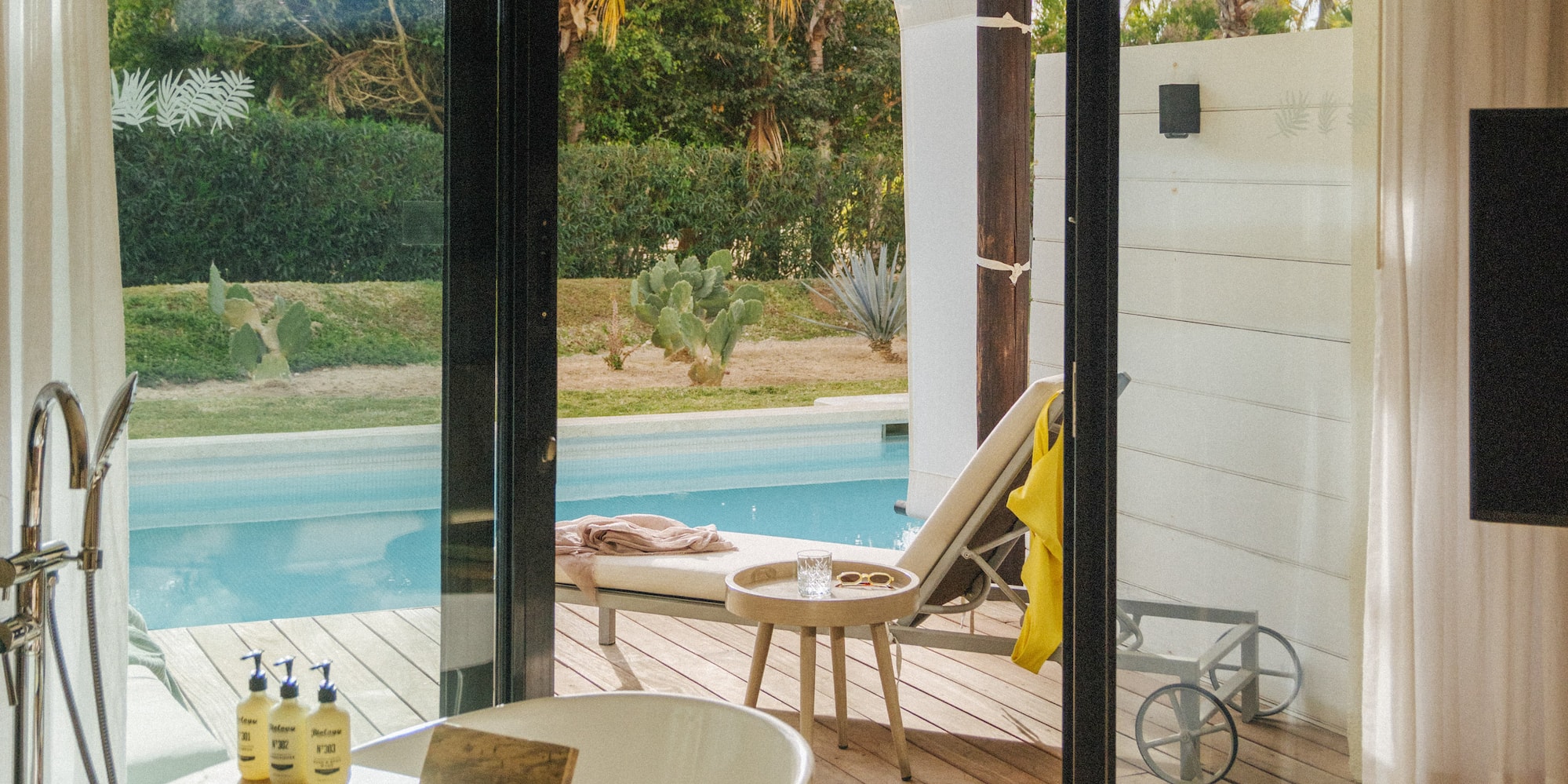 a bathroom with a tub and a pool