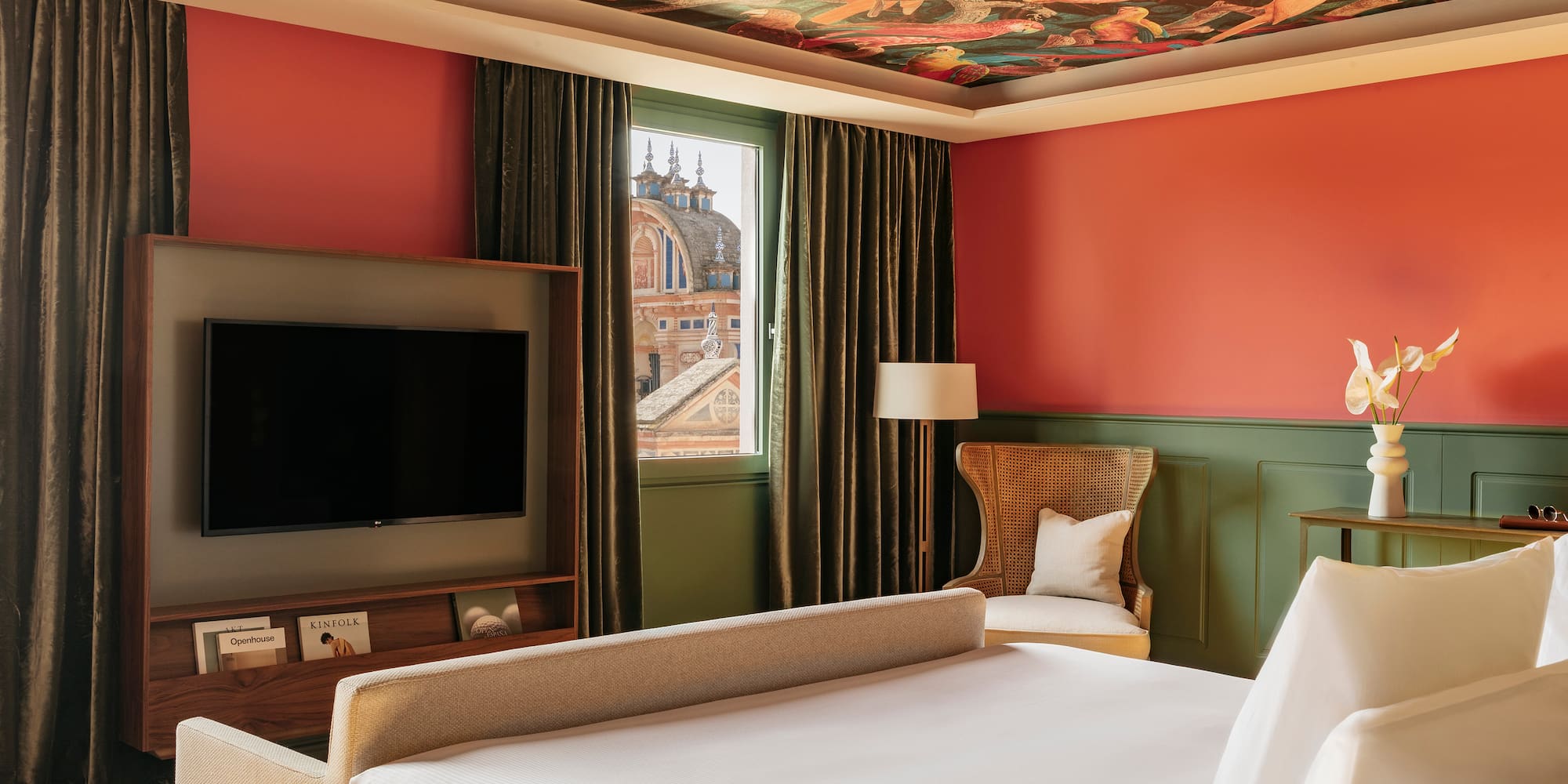 a room with a bed and a tv