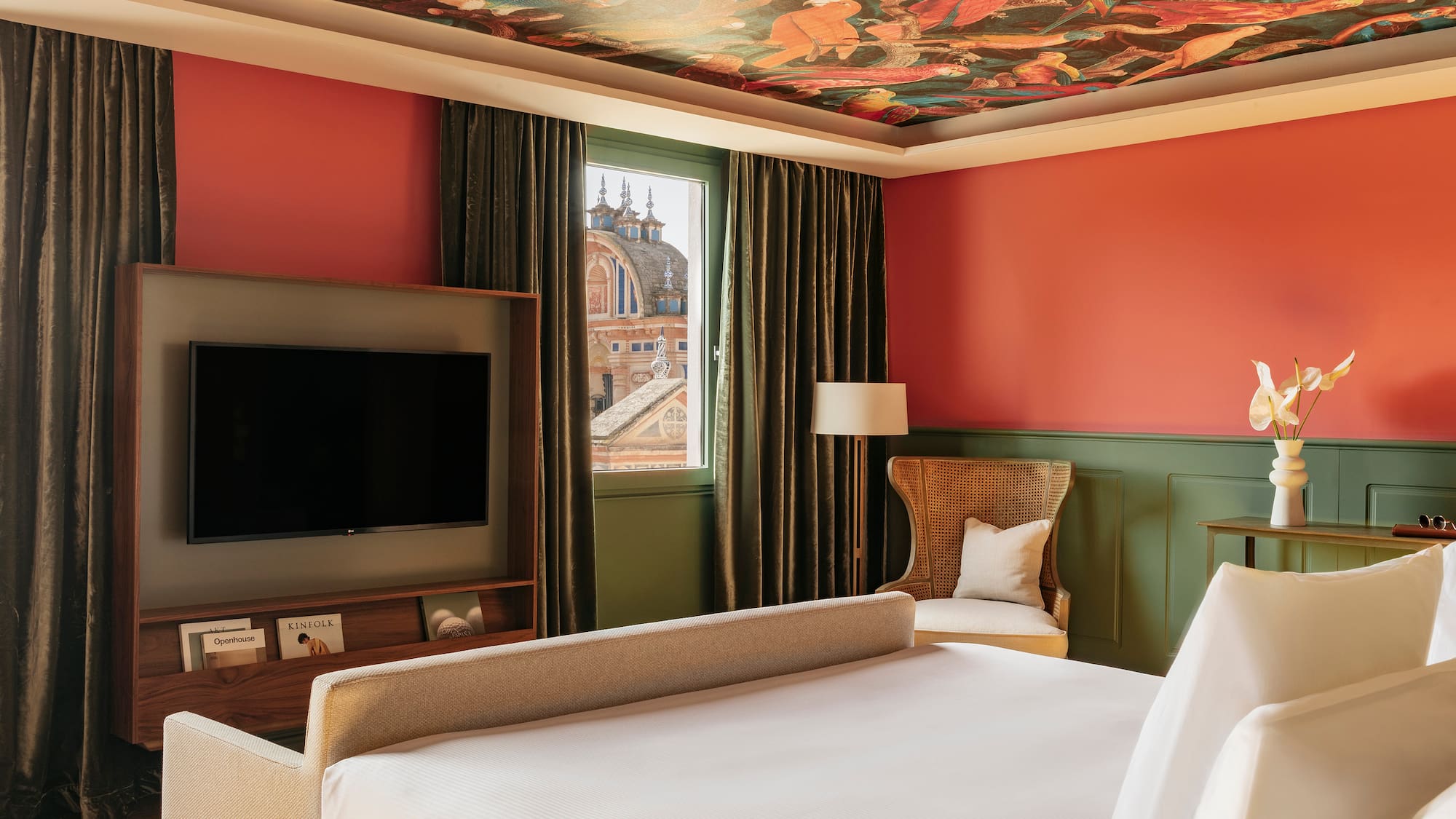 a room with a bed and a tv