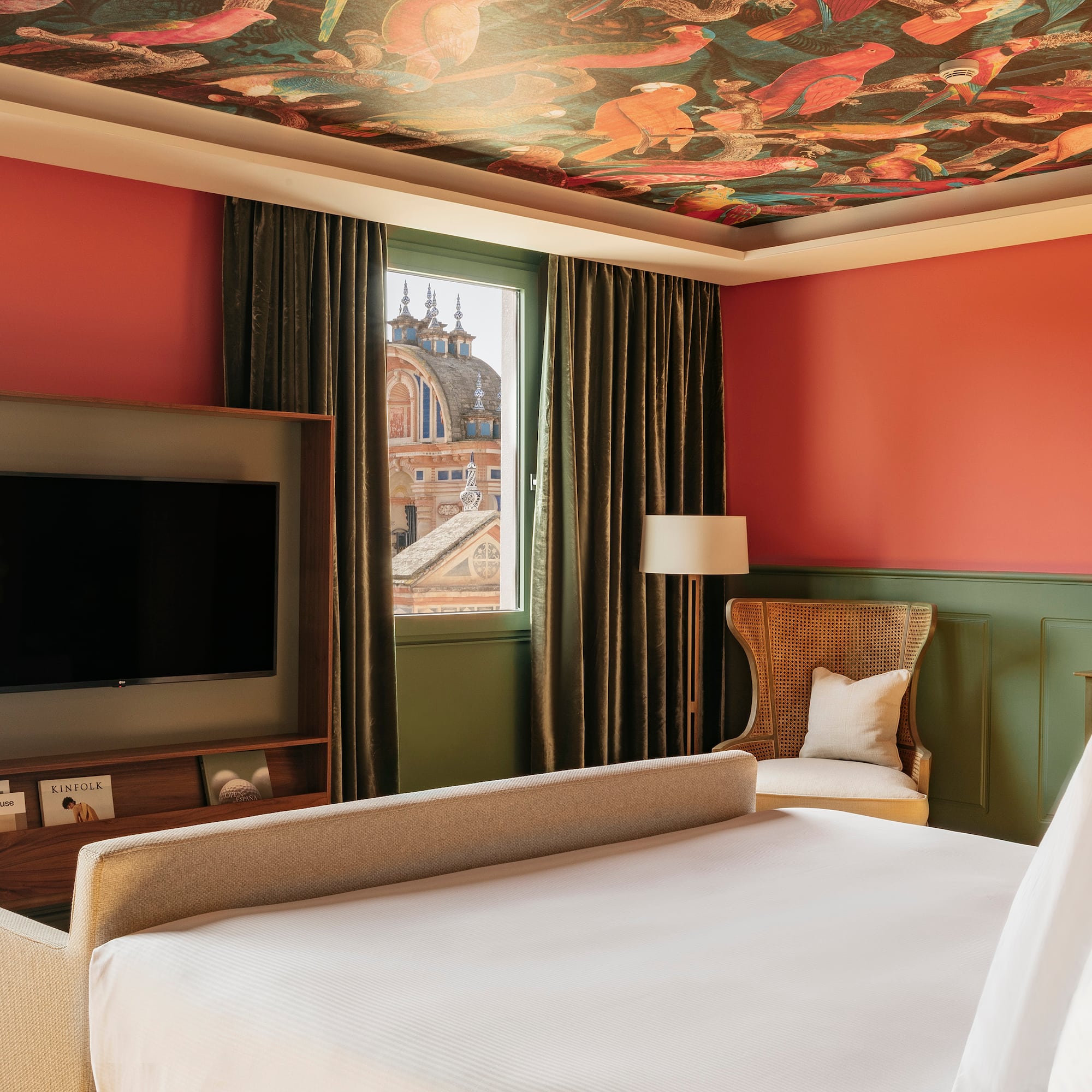 a room with a bed and a tv