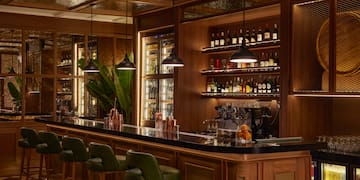 a bar with shelves of liquor and bottles