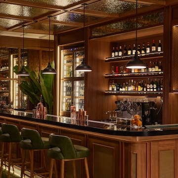 a bar with shelves of liquor and bottles