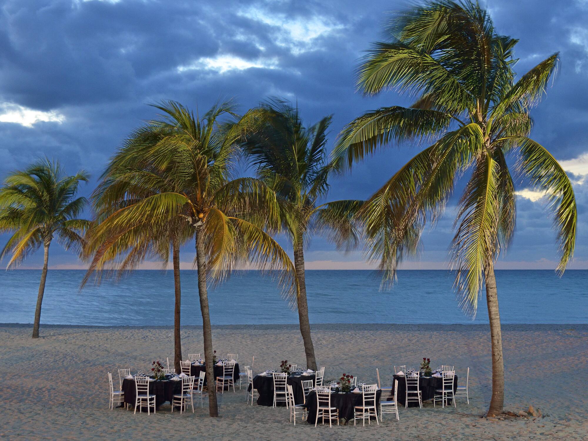a group of tables on a beach
