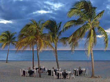 a group of tables on a beach