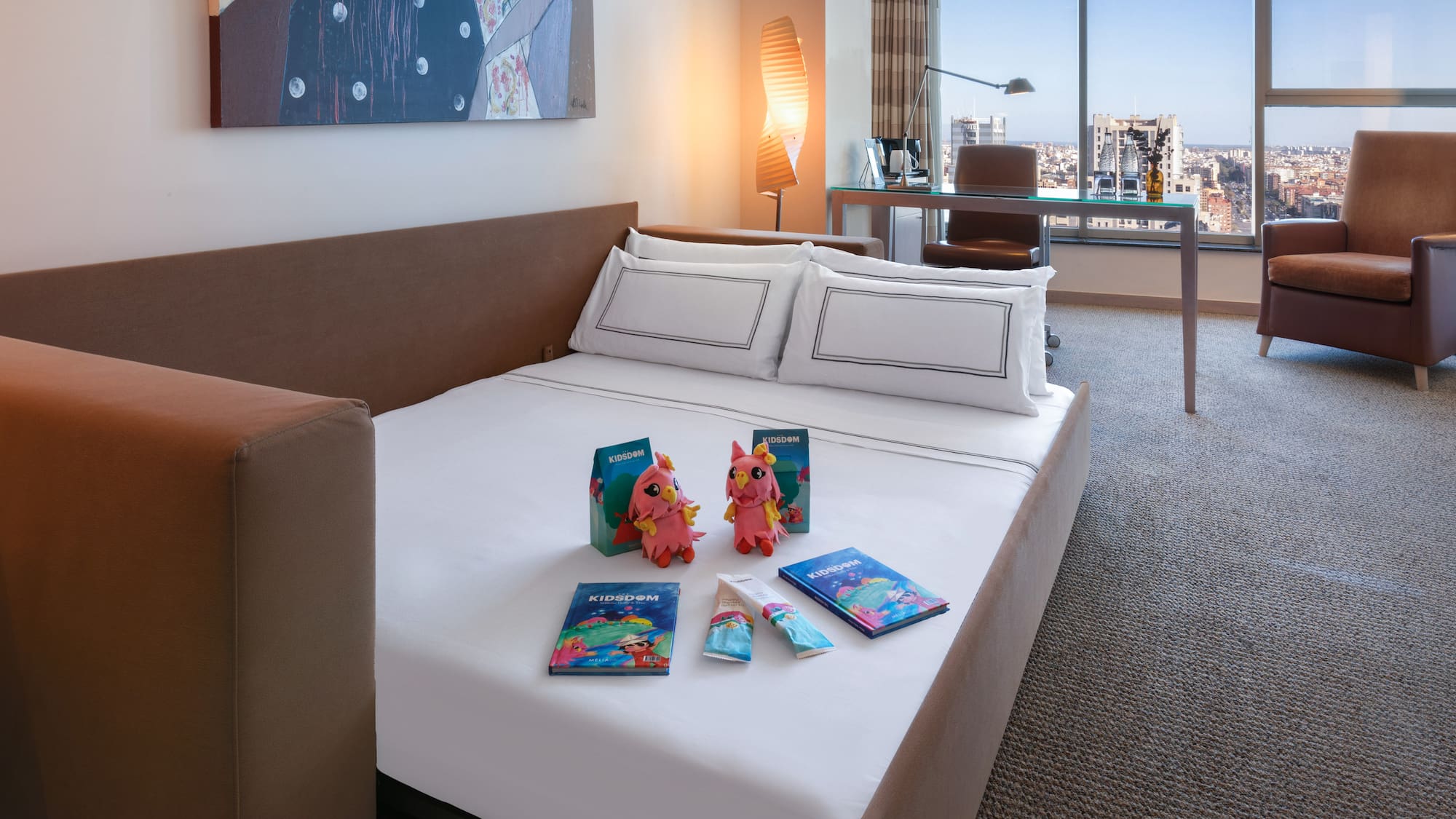 a bed with a couple of stuffed animals on it