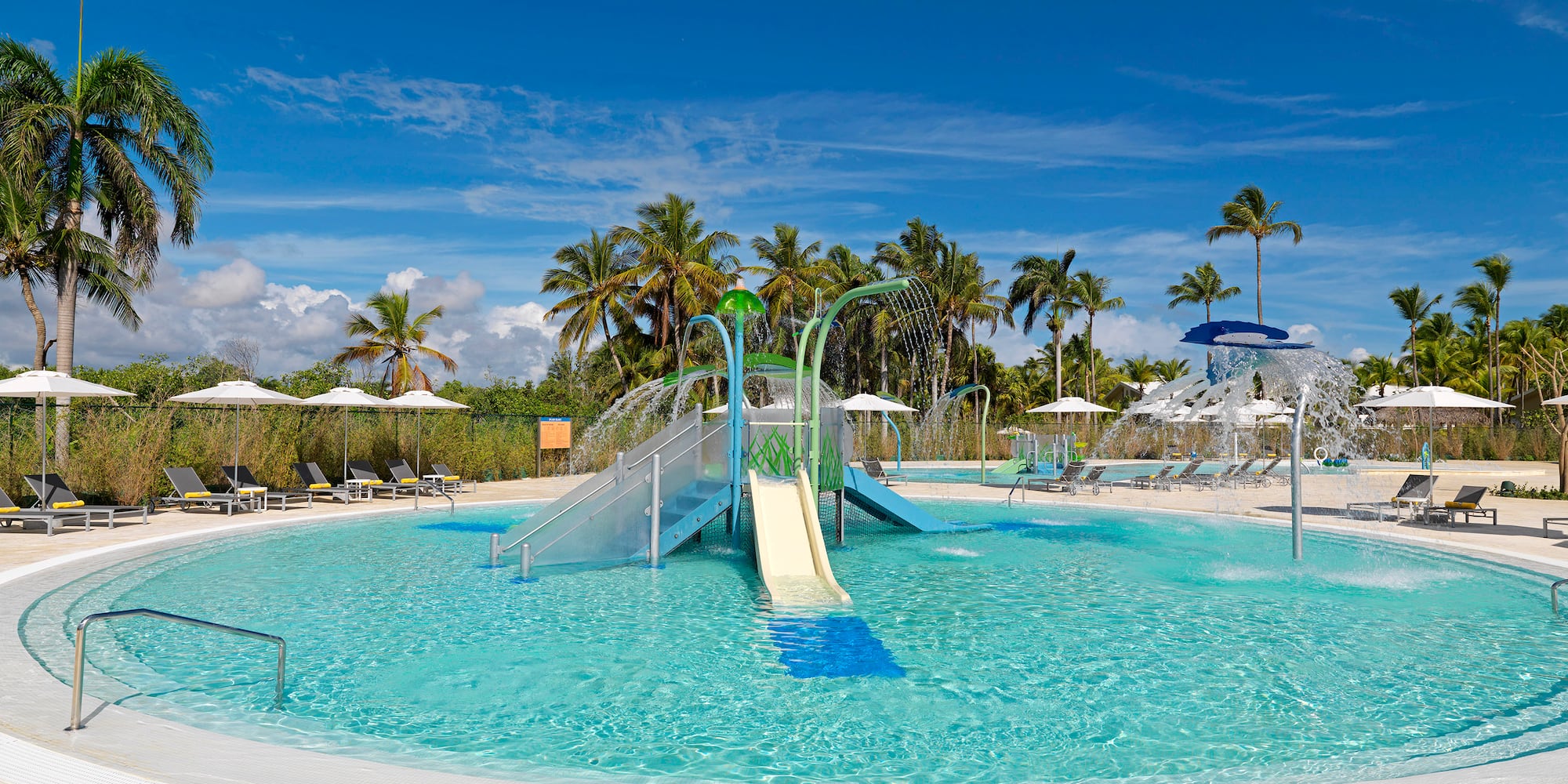 a pool with a slide and a slide