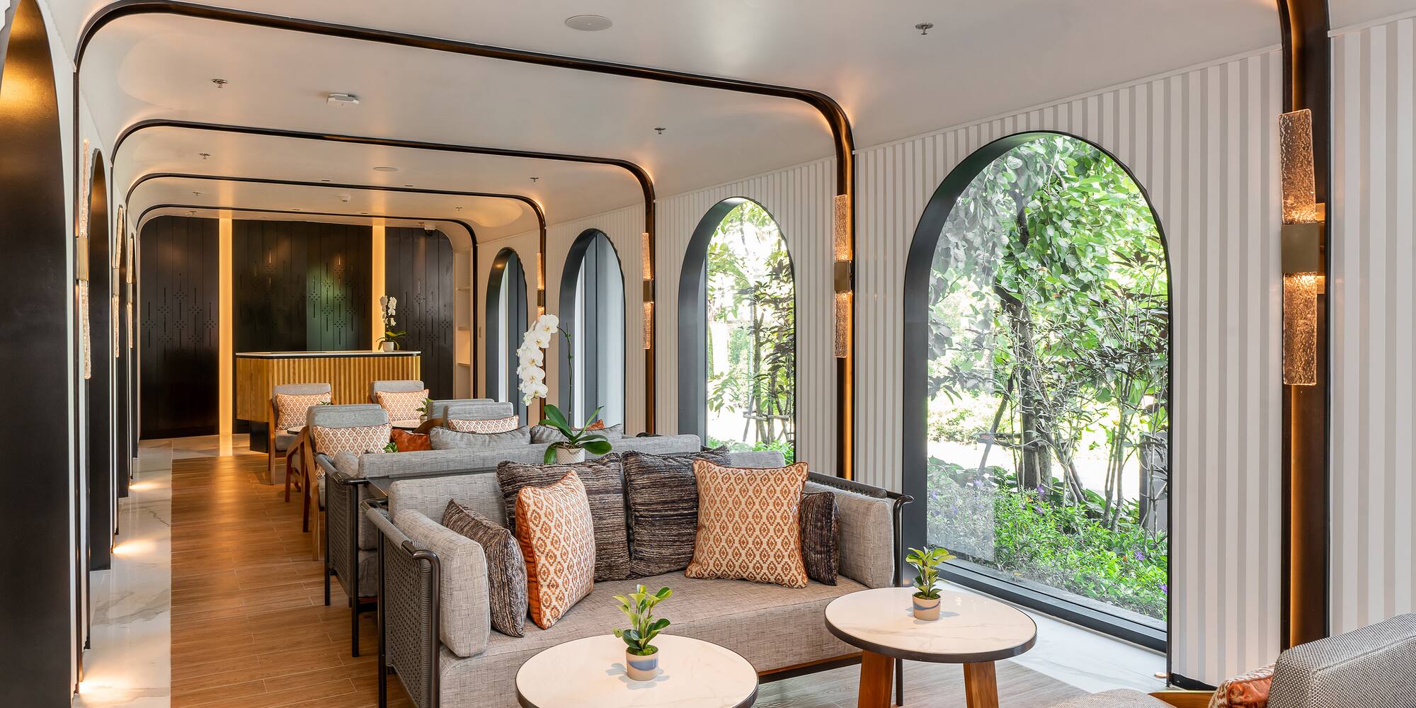 a room with a couch and tables