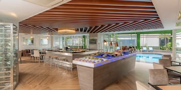 a buffet in a room with a pool