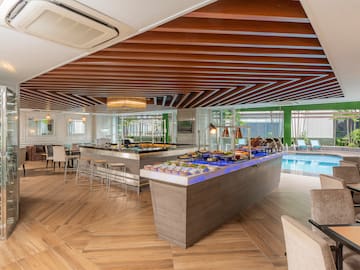 a buffet in a room with a pool