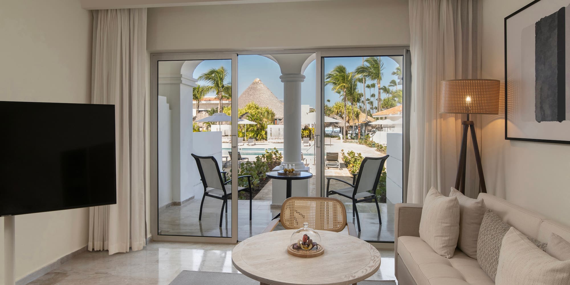 a living room with a television and a table