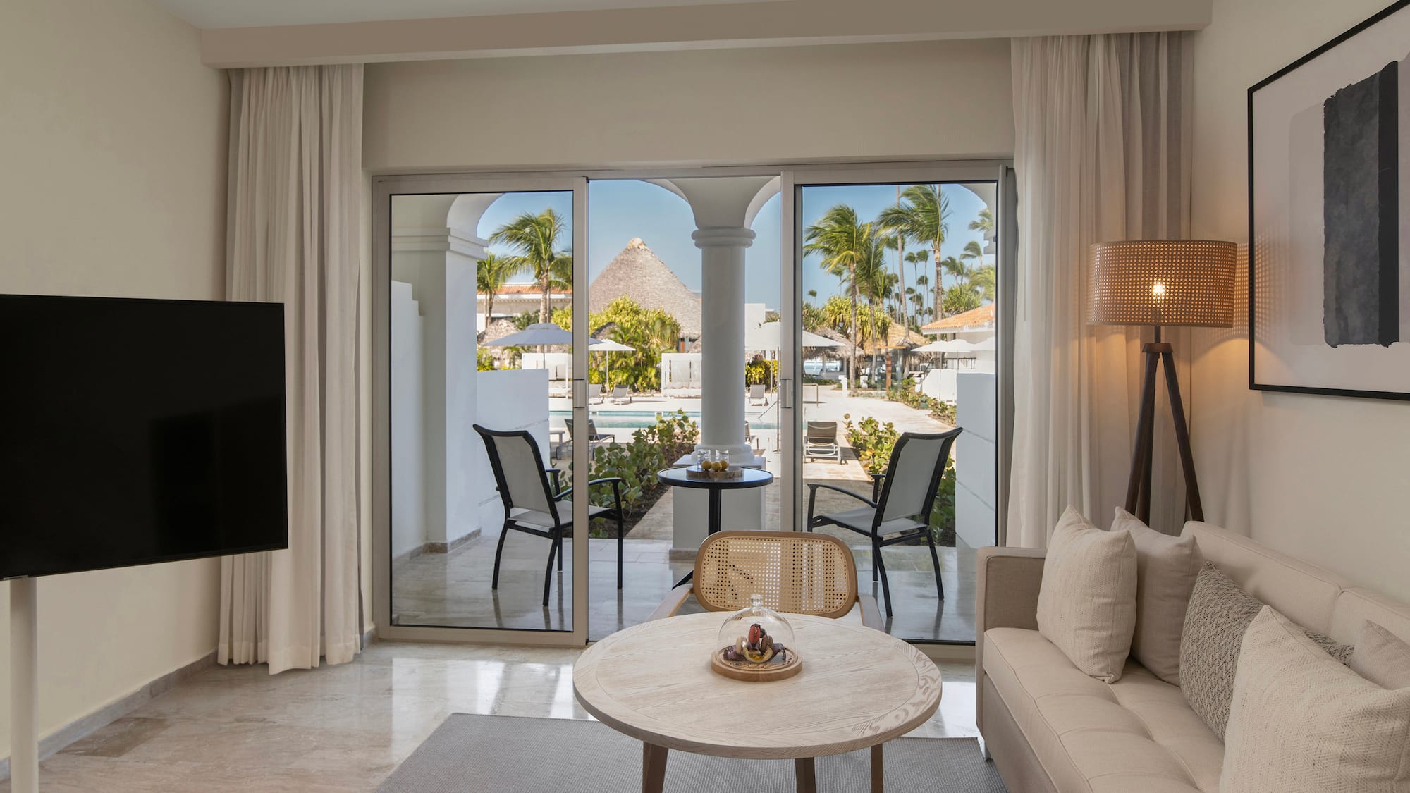 a living room with a television and a table
