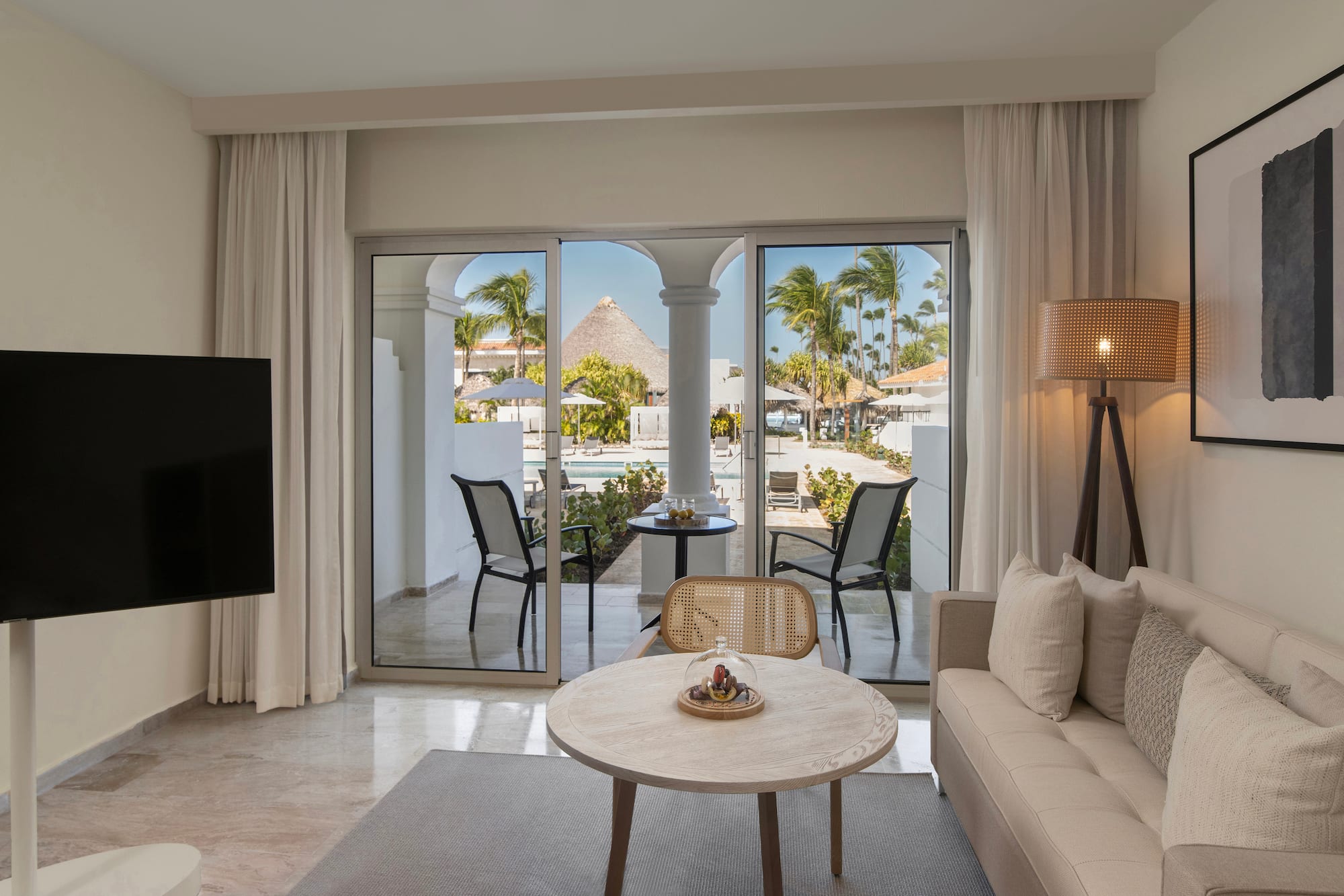 a living room with a television and a table