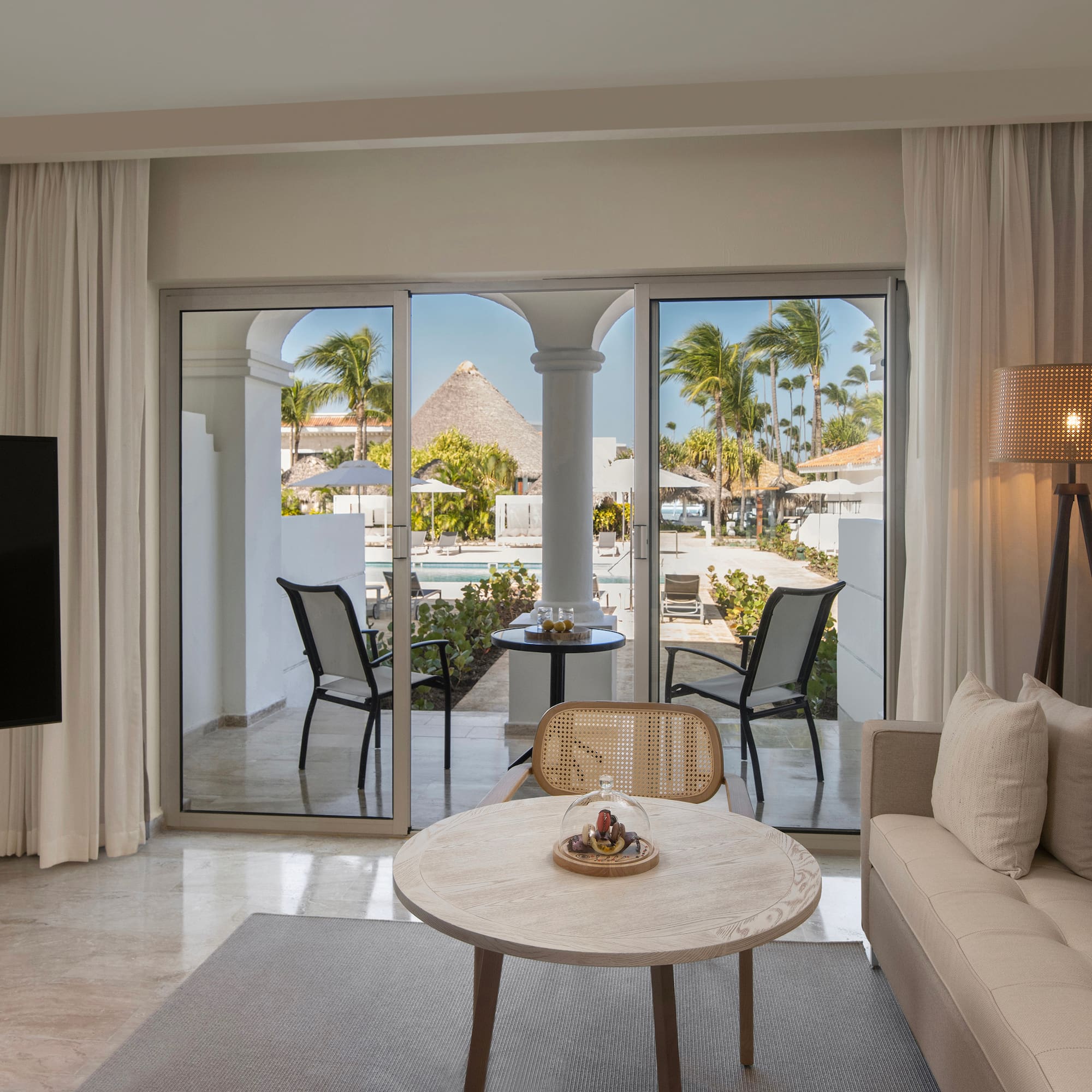 a living room with a television and a table