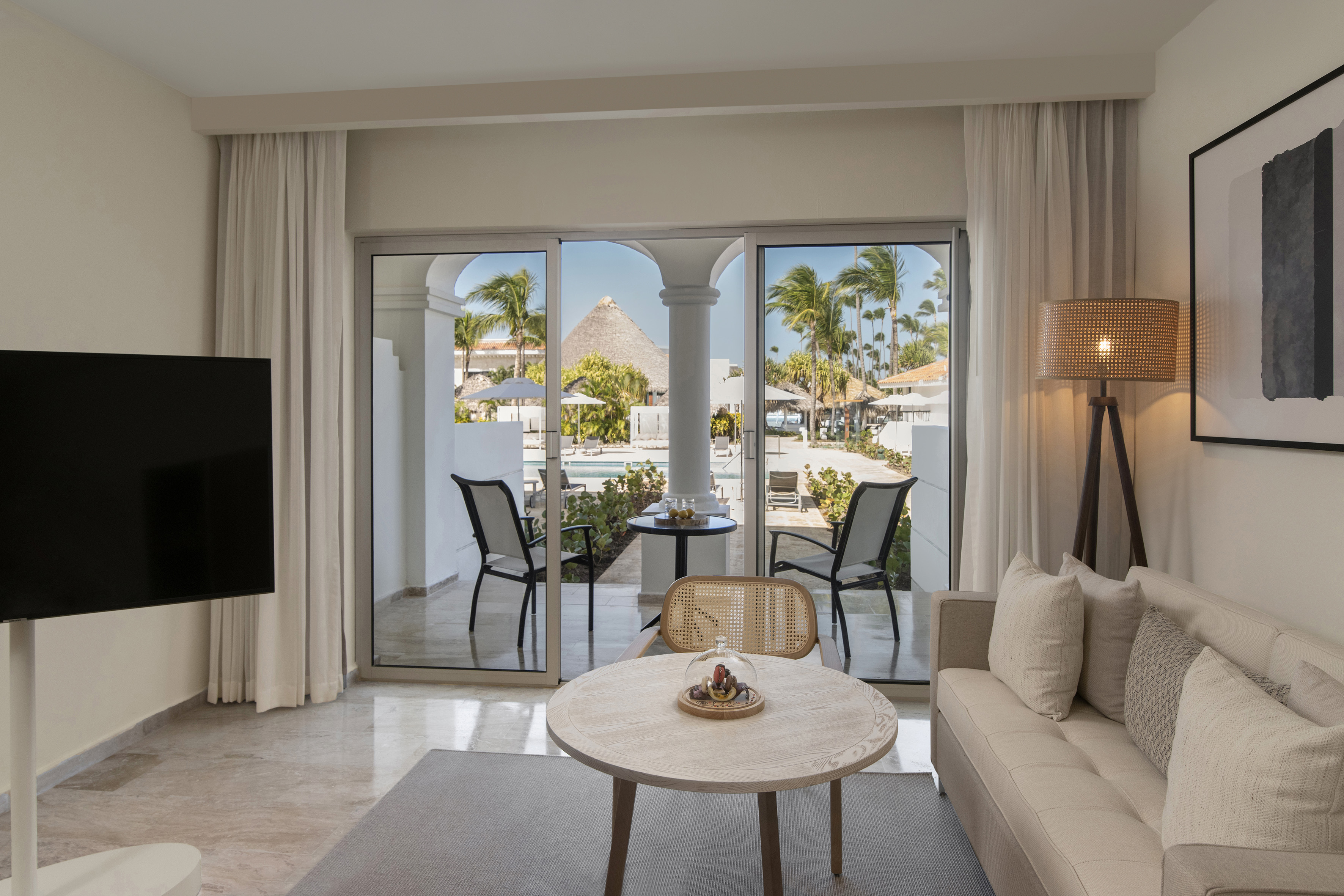 a living room with a television and a table