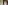 a man and woman standing in a room with columns