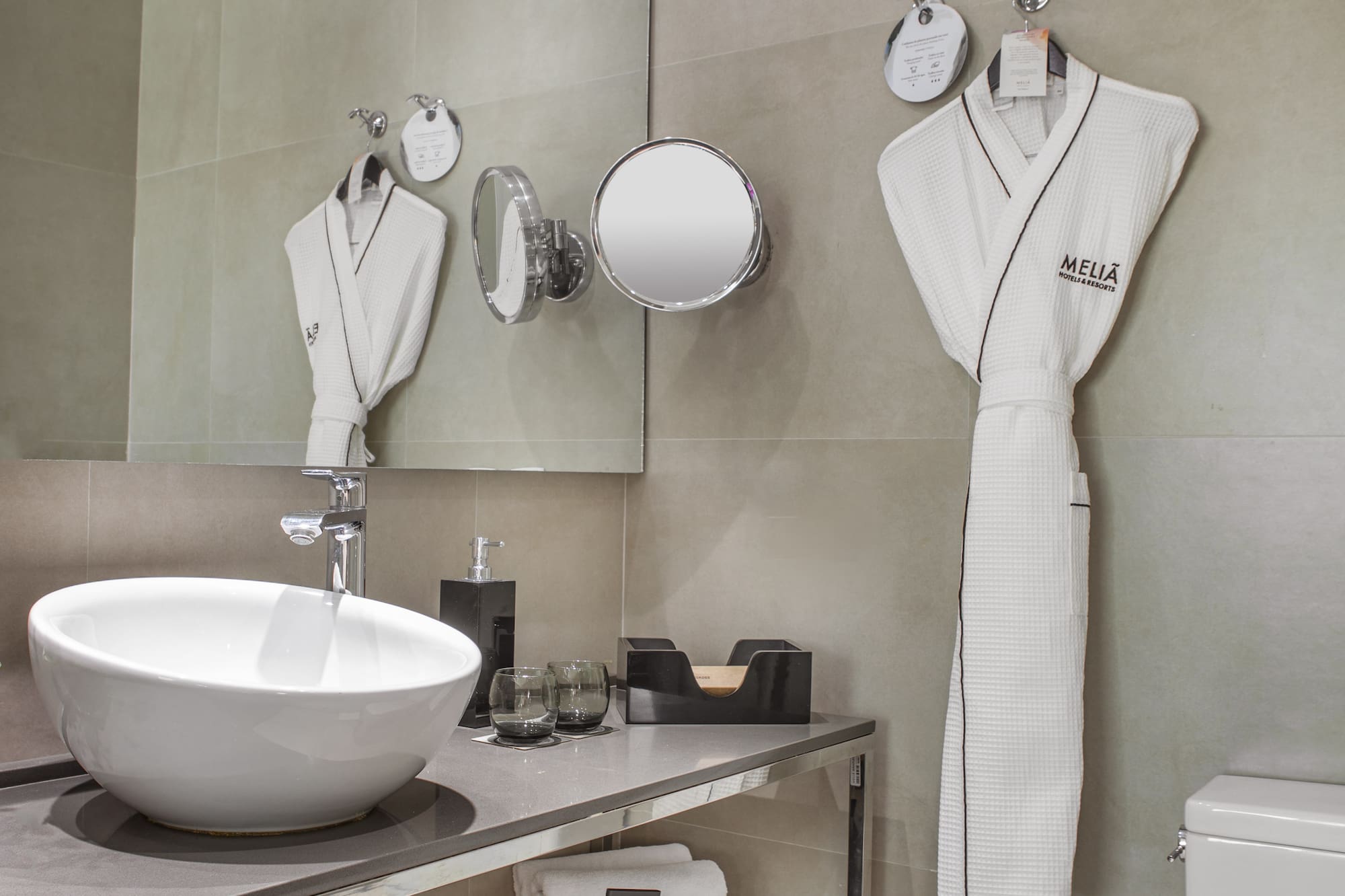 a bathroom with a sink and towels