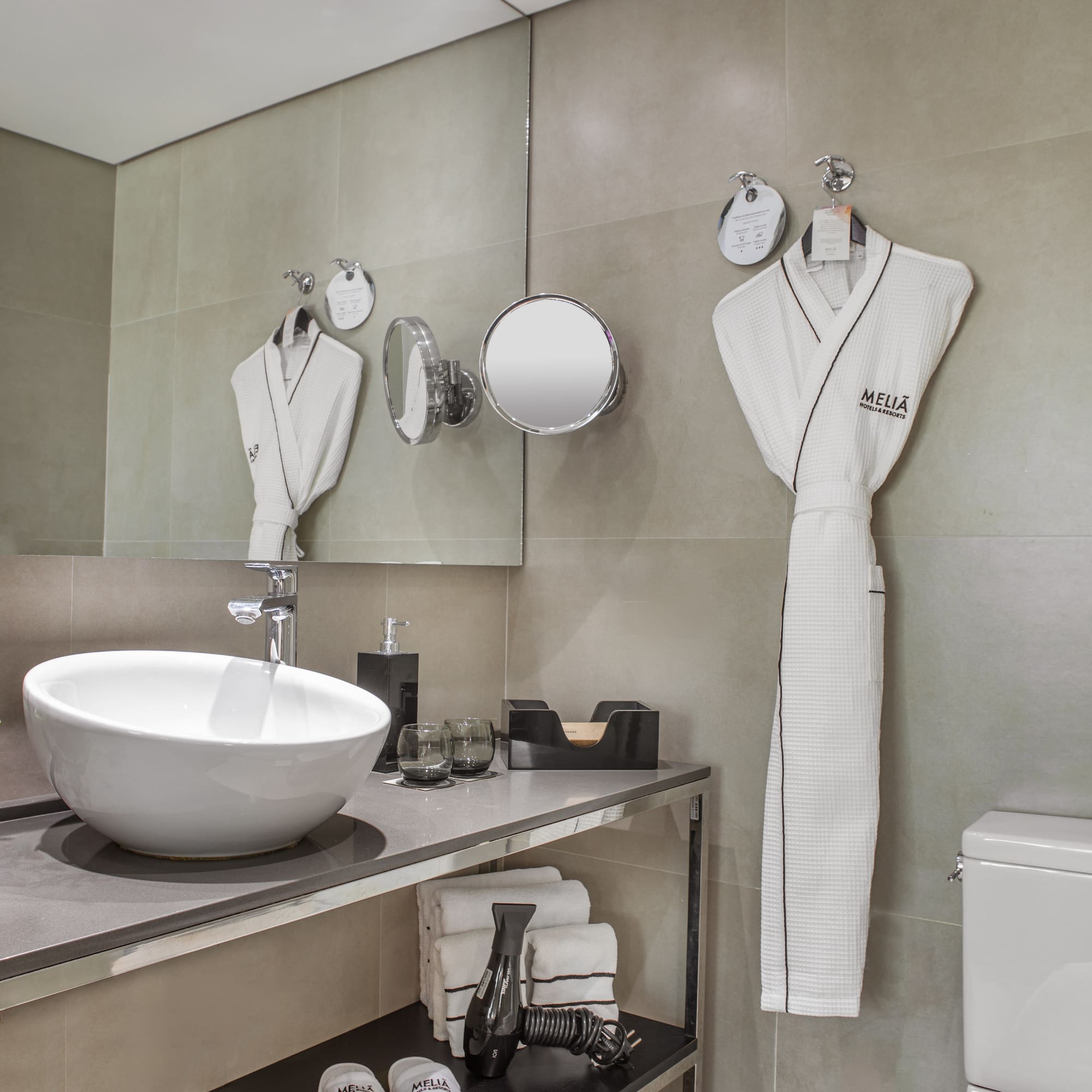 a bathroom with a sink and towels