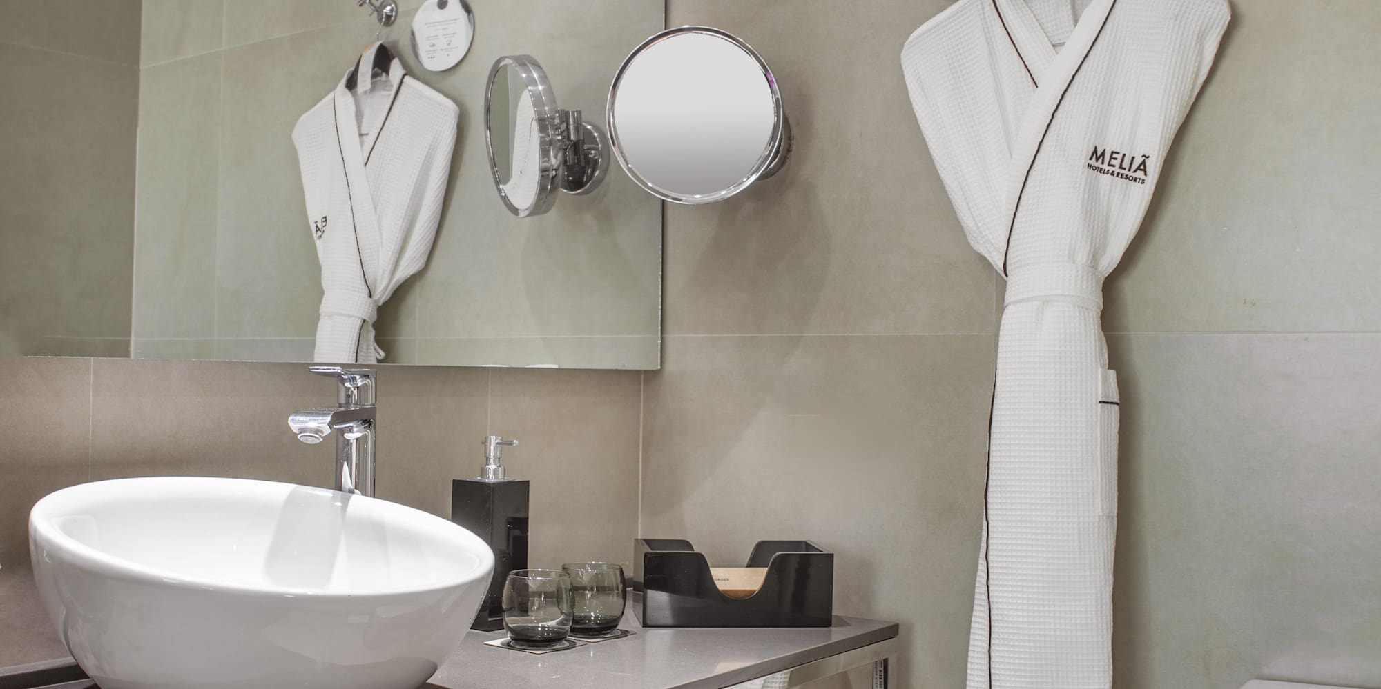 a bathroom with a sink and towels