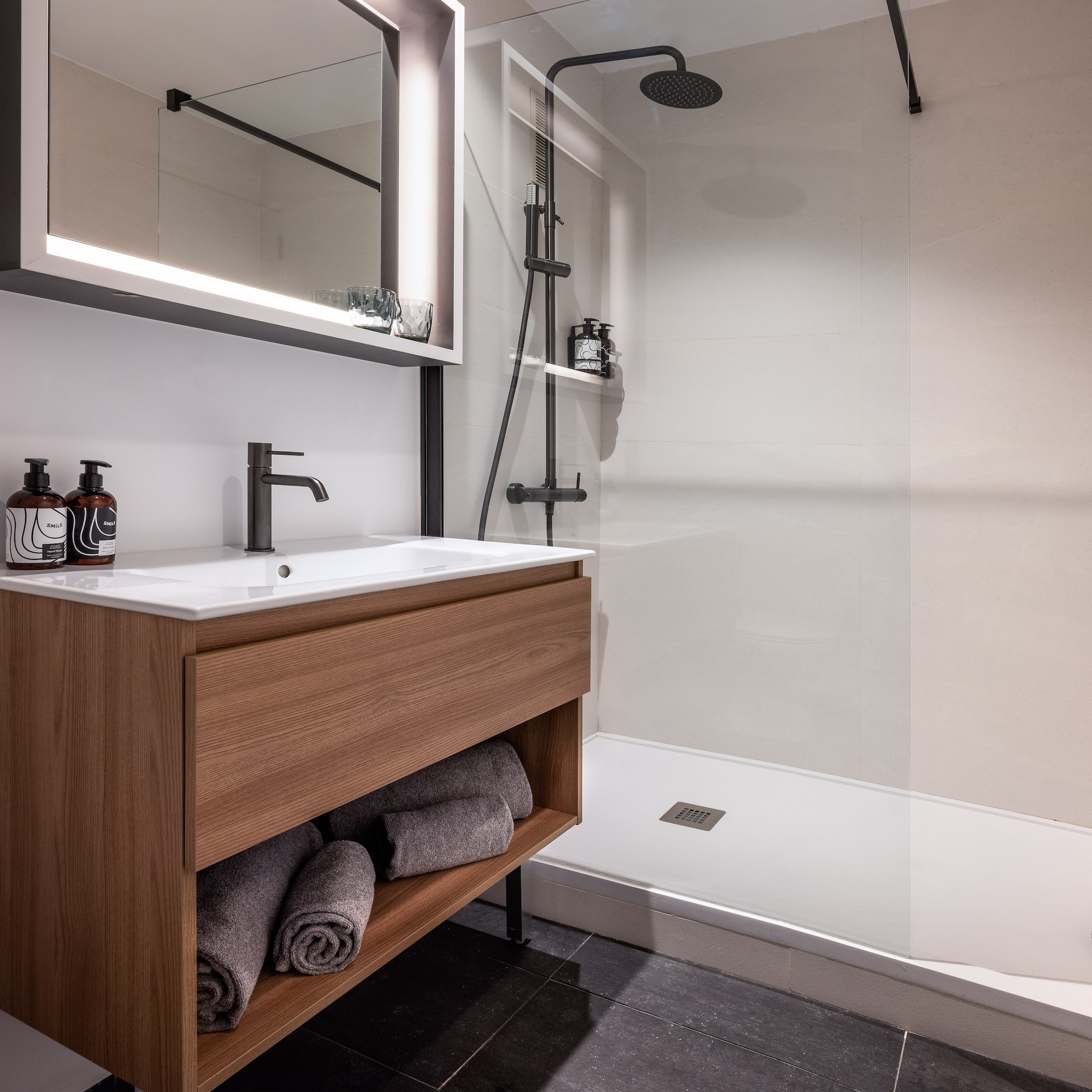 a bathroom with a shower and a sink