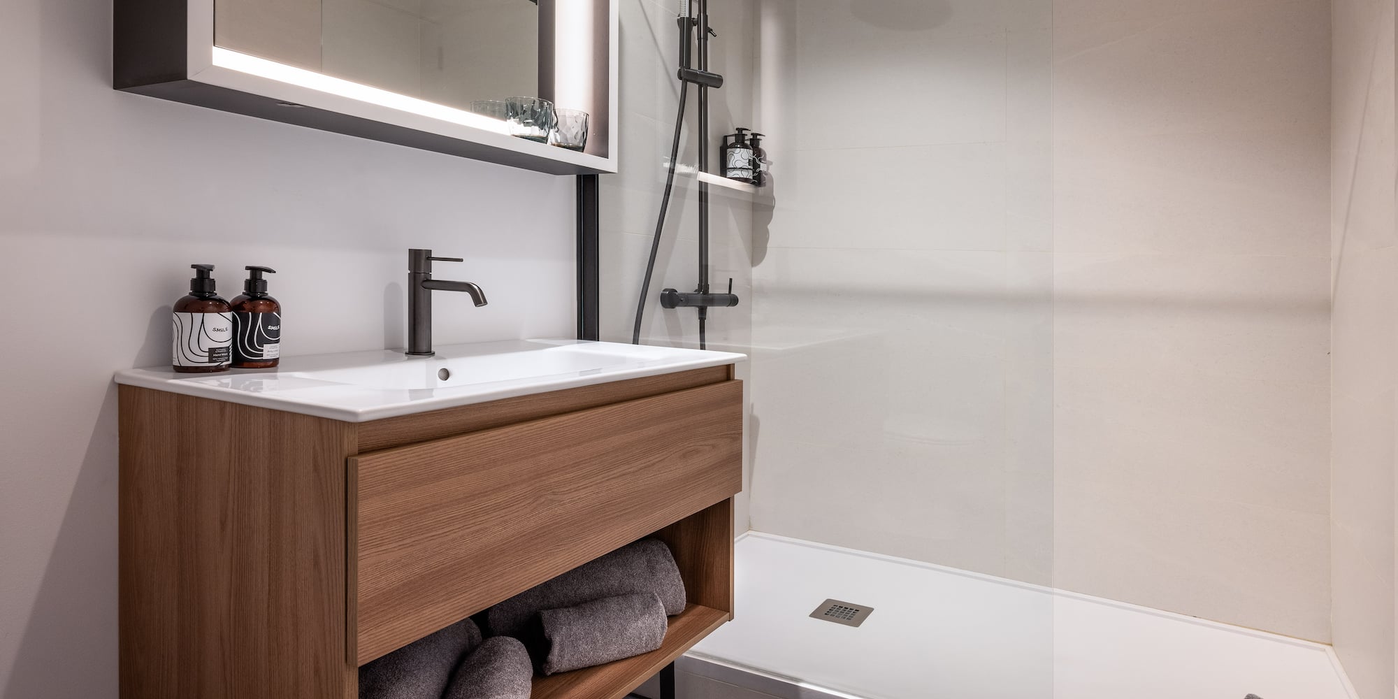 a bathroom with a shower and a sink