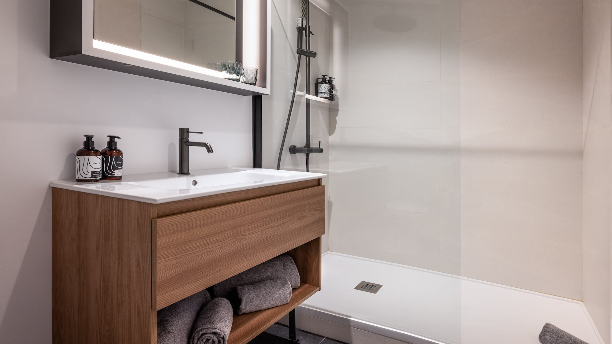 a bathroom with a shower and a sink