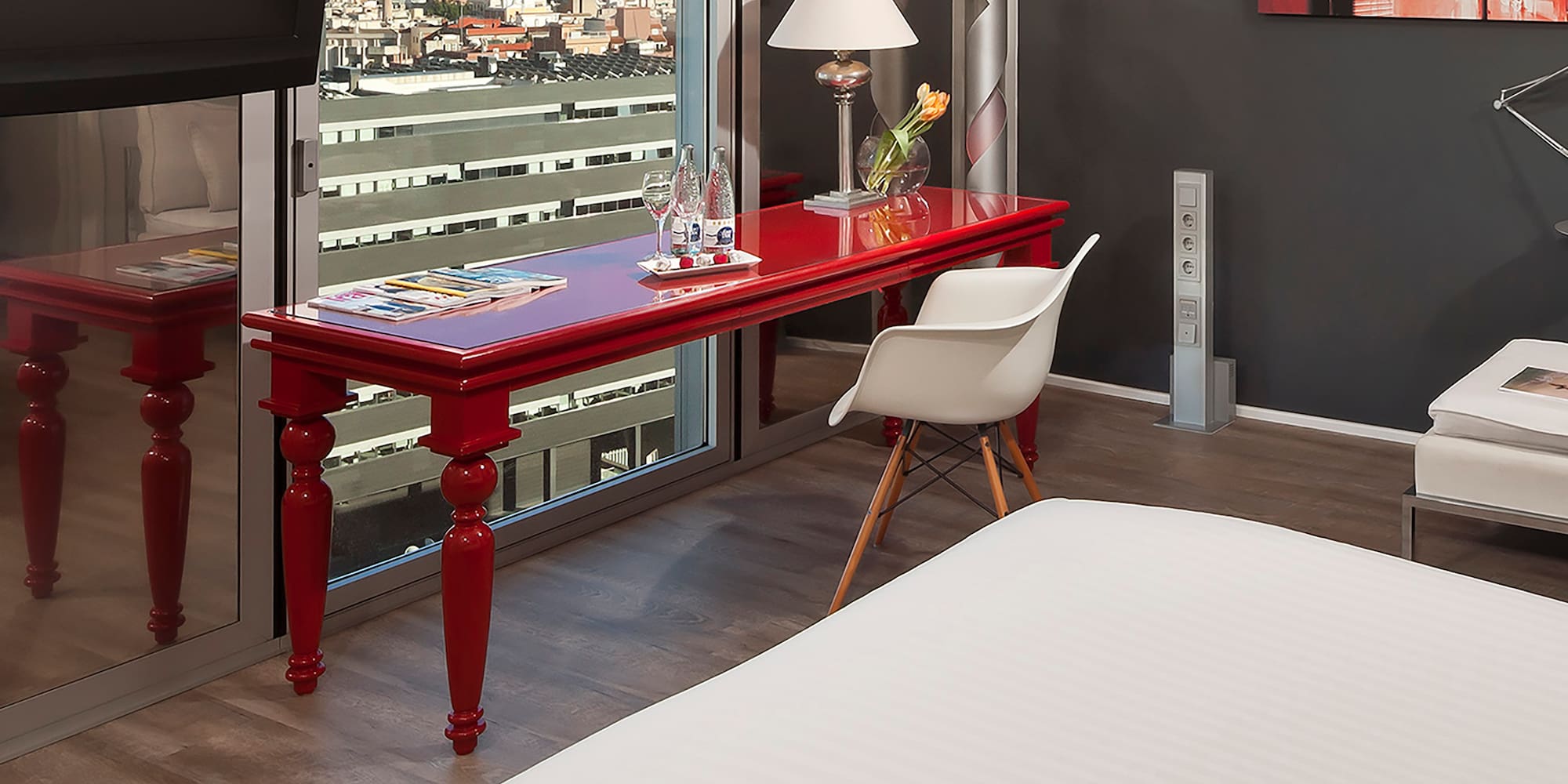 a room with a red table and a tv