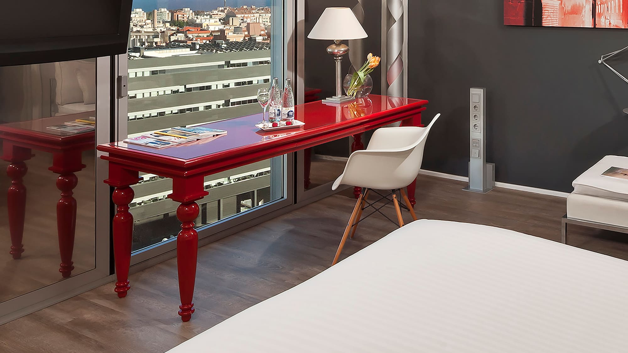 a room with a red table and a tv