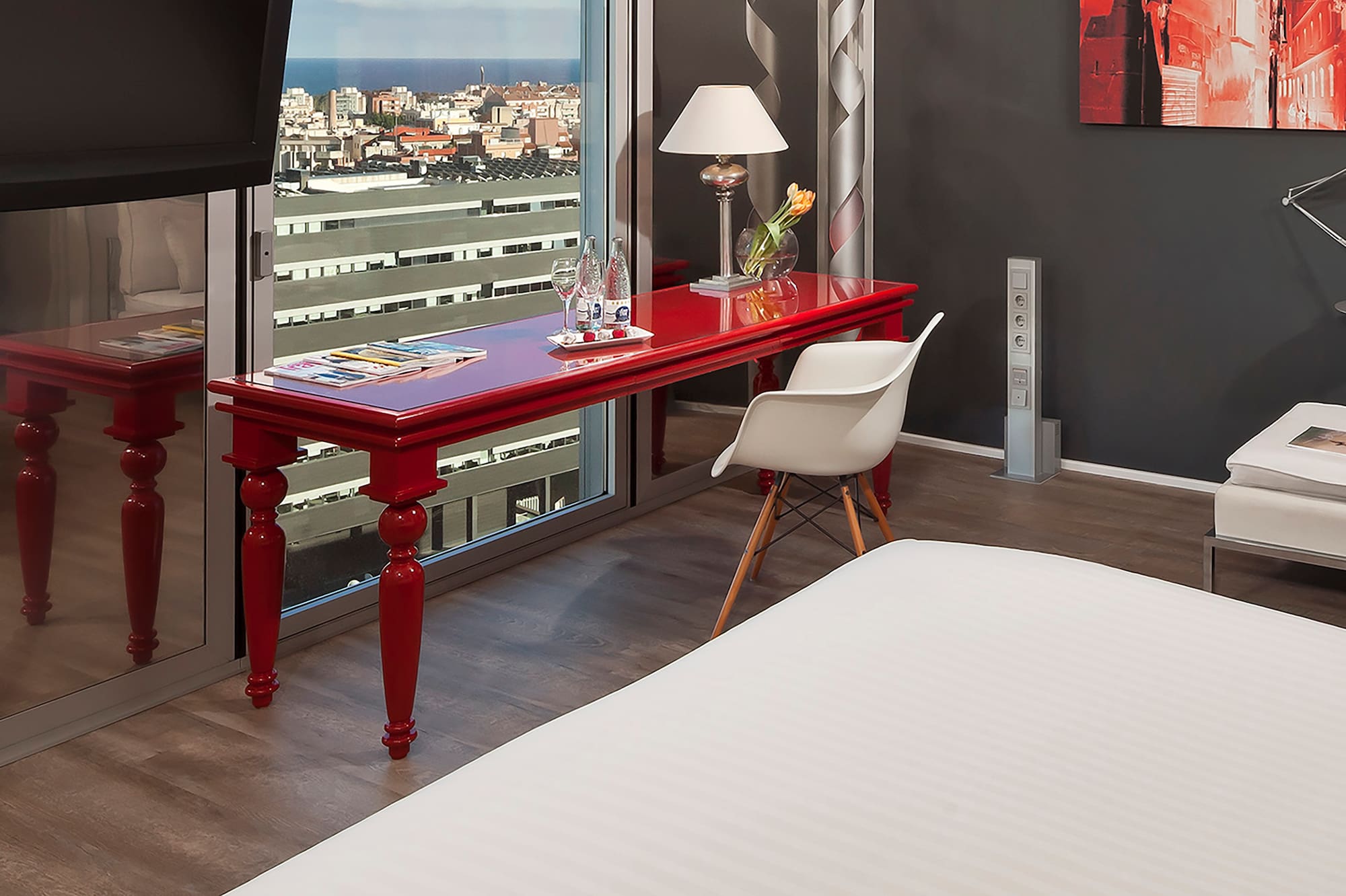 a room with a red table and a tv