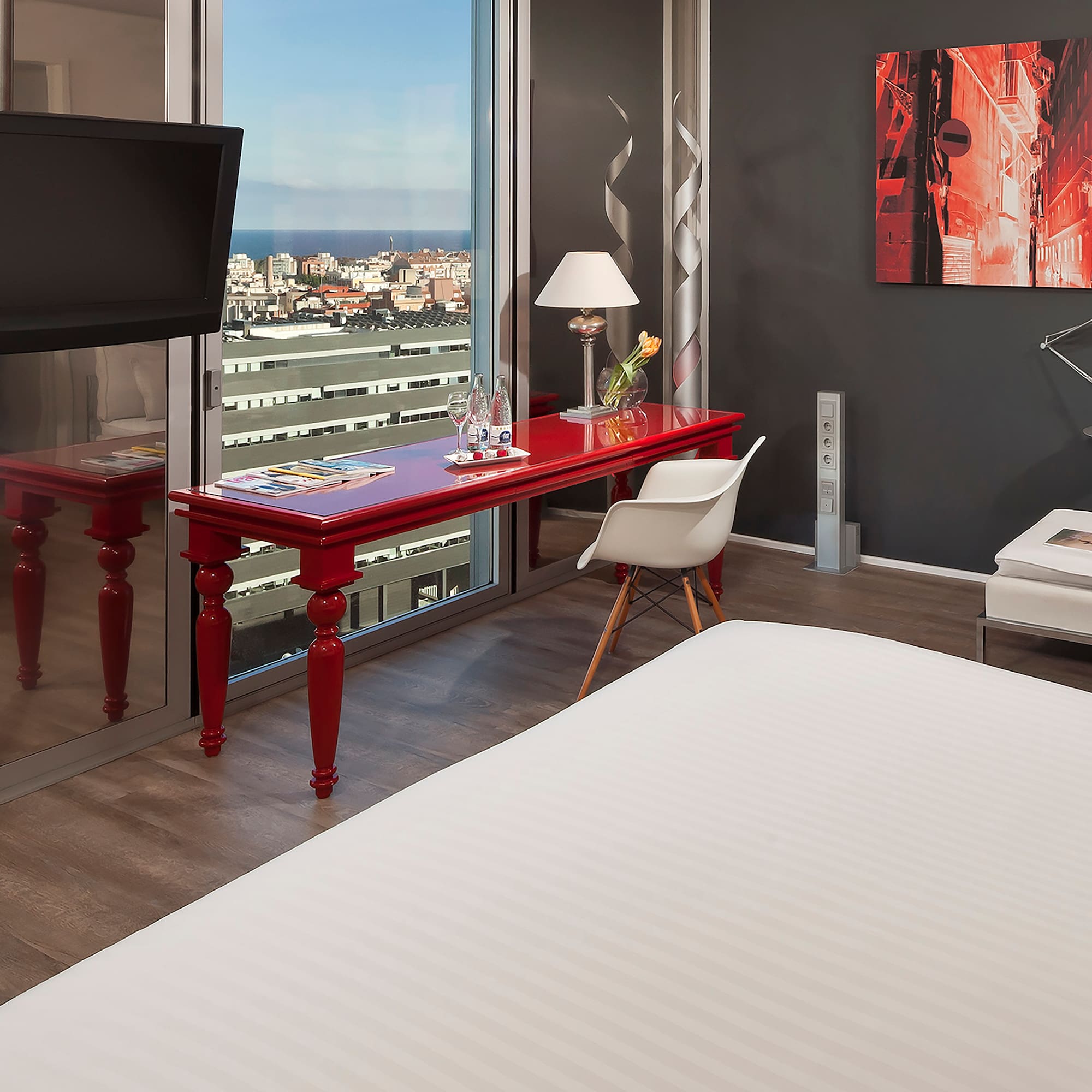 a room with a red table and a tv