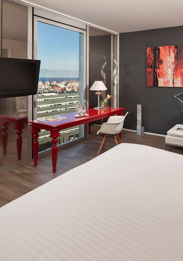 a room with a red table and a tv