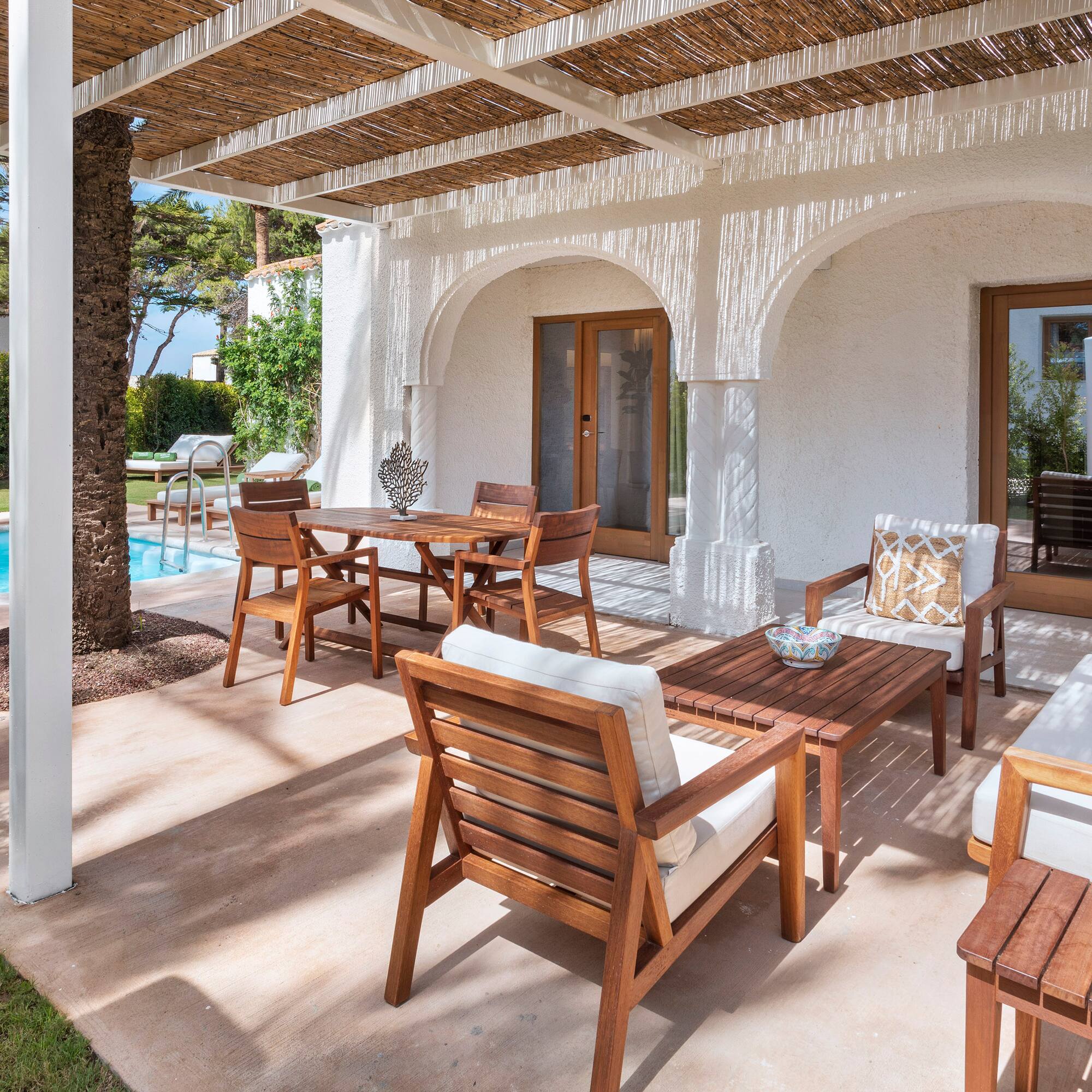 a patio with a table and chairs