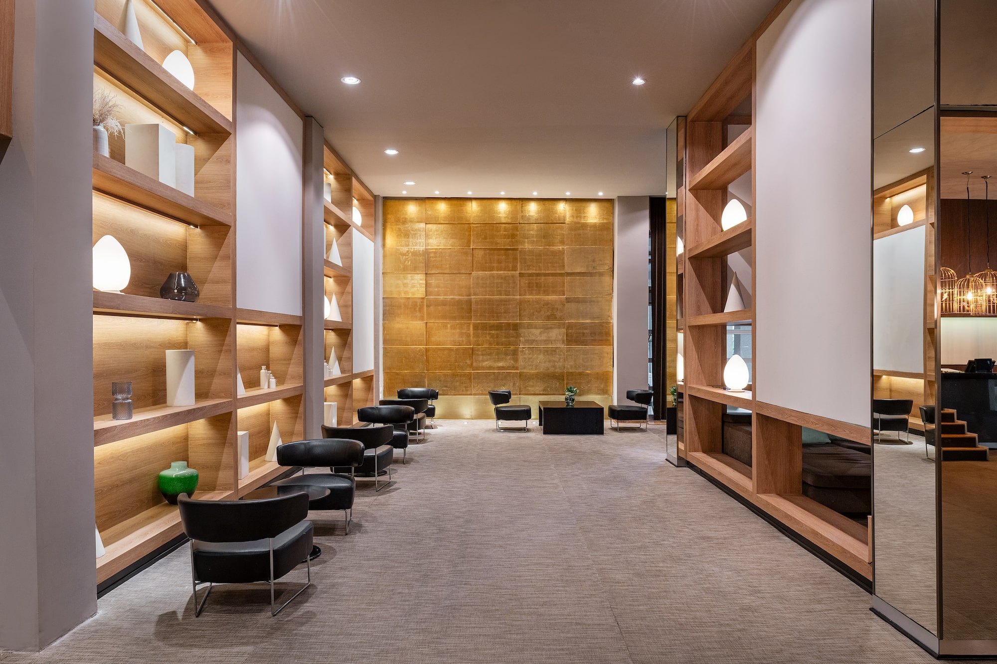 a room with a row of chairs and shelves