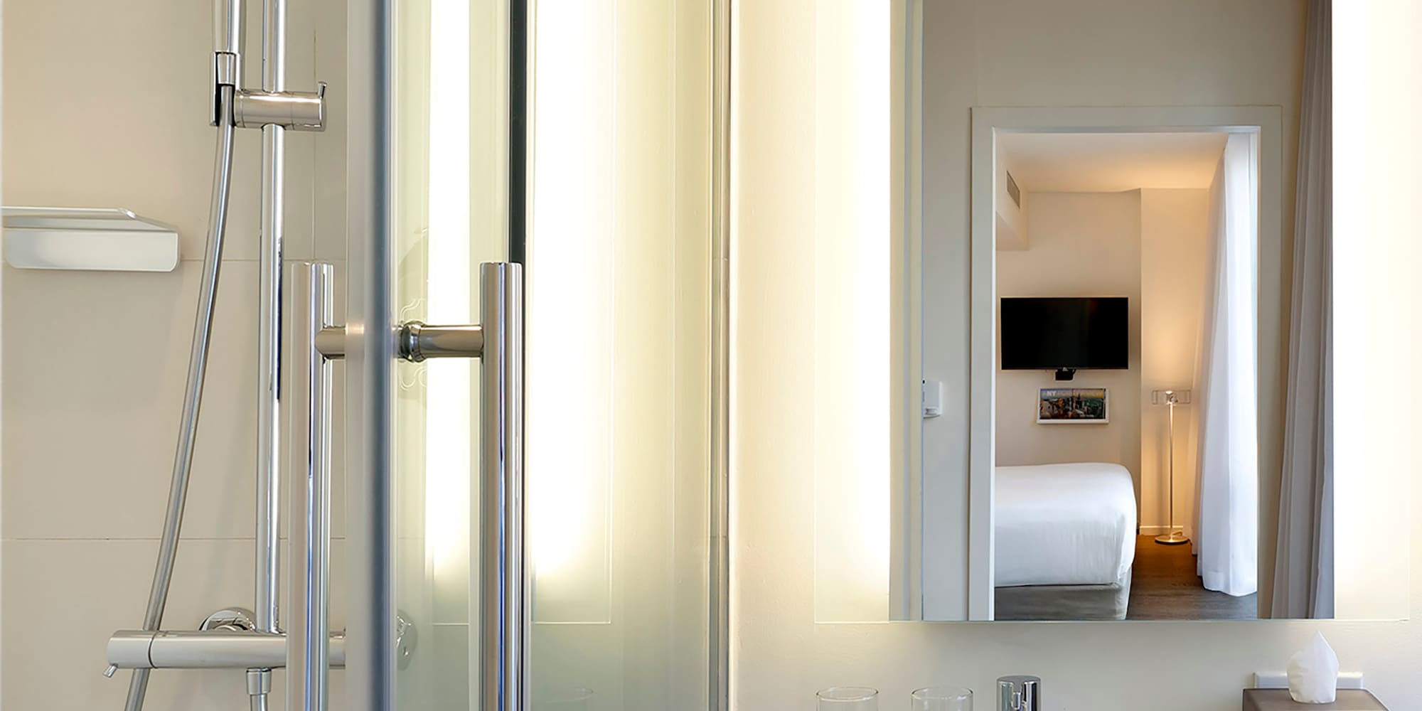 a bathroom with a shower and a mirror